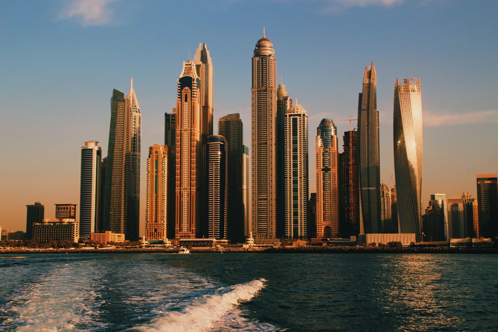 Dubai Marina towers seen from the sea at sunset